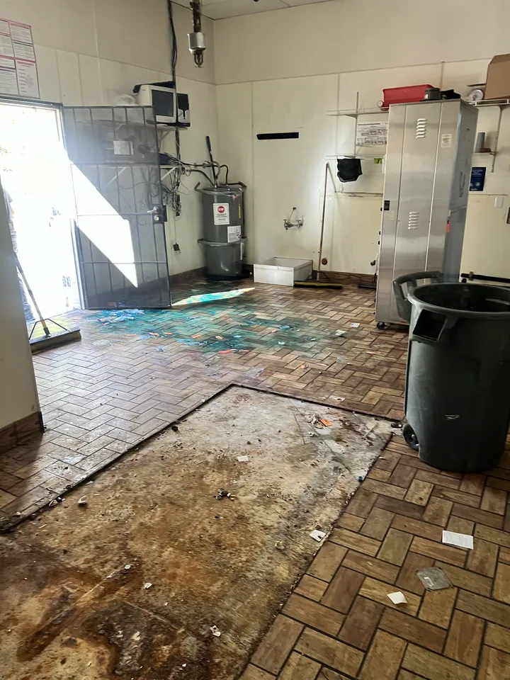 The same job from the back. Swept, with nothing left against the walls.