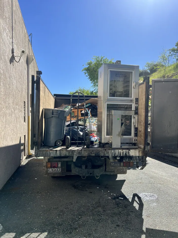 A commercial kitchen clearout. Equipment that heavy comes out on a ramp, not down a flight of stairs.